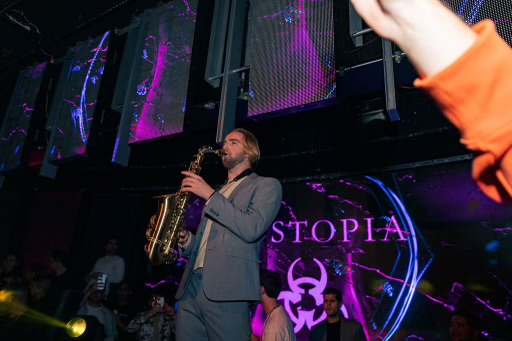 Henry Gritton performing saxophone on stage