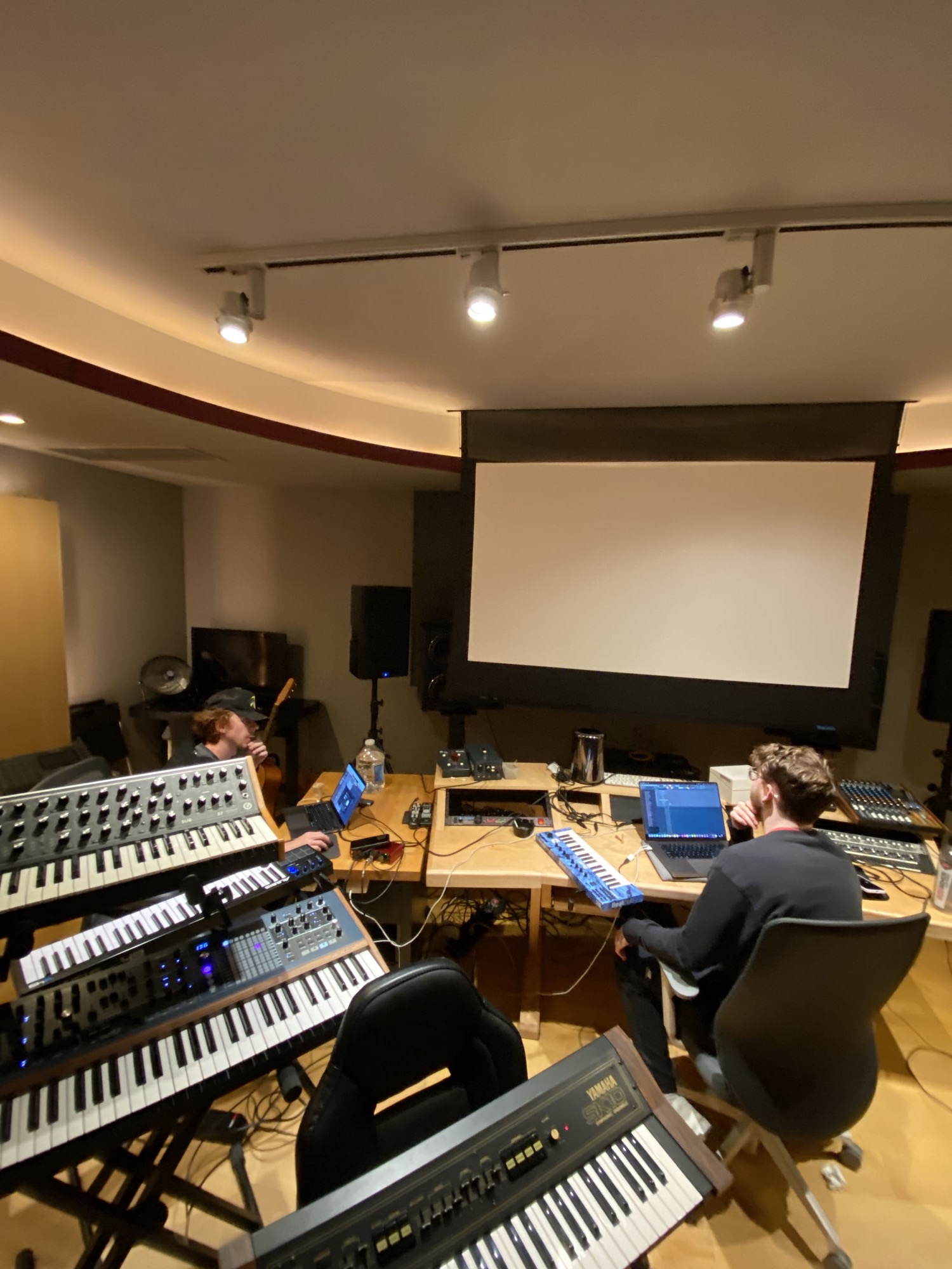 Producer desk with synthesizers and monitors